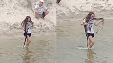 Brave-Girl-Shares-a-Special-Moment-Carrying-a-Huge-Snake.jpg