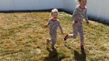 Little-girl-triumphantly-falls-from-slide-after-winning-race-with.jpg