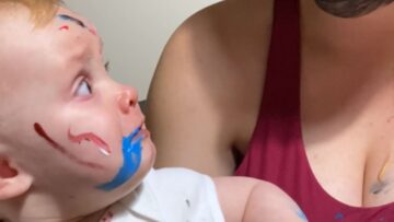 Baby-girl-is-shocked-by-moms-paint-face-Cute.jpg