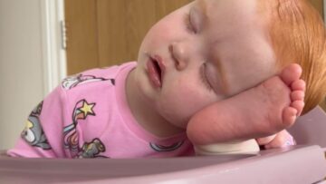 Baby-naps-in-high-chair-using-tiny-foot-pillow.jpg