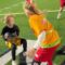 Kid Outshines Athletes in Epic Flag Football Showdown | Adorable!